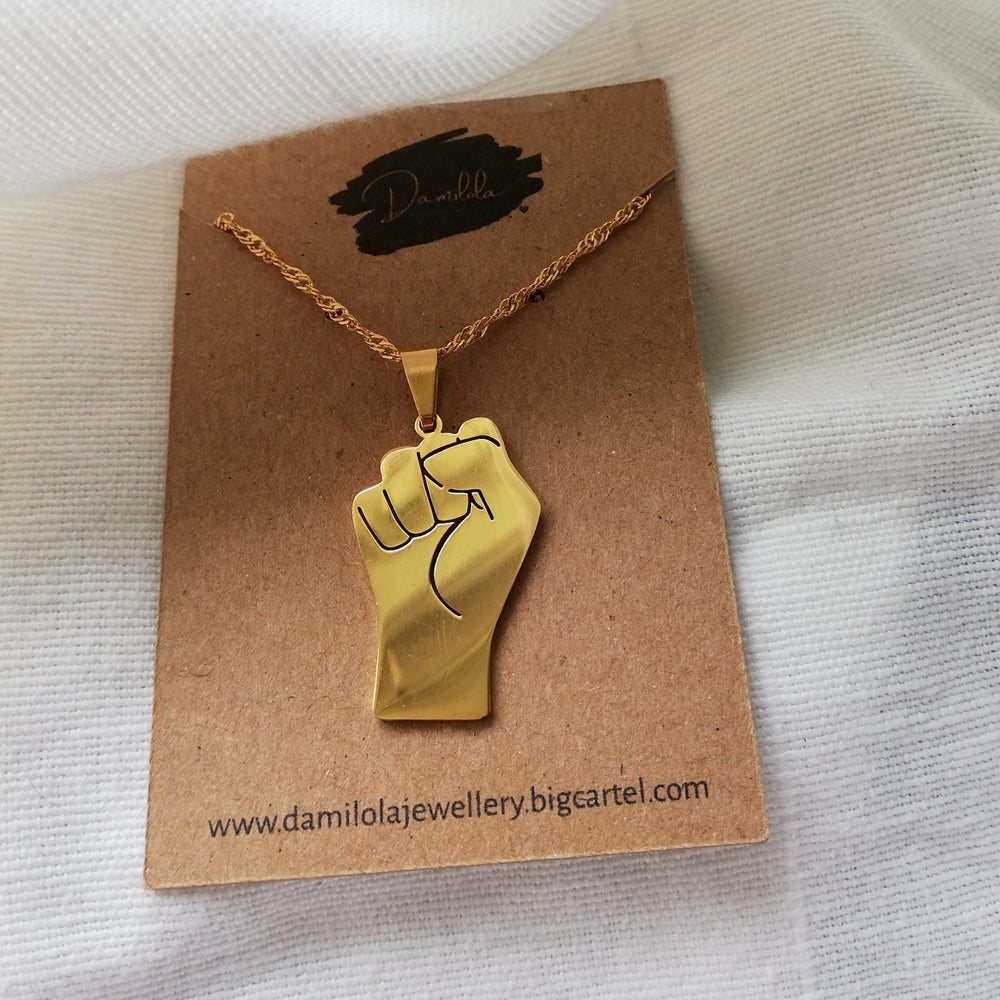 'United We Stand' Fist Necklace - Gold/Silver